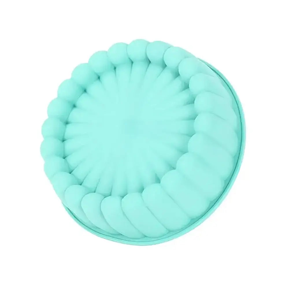 Moule à charlotte en silicone bleu avec des bords ondulés. Le diamètre du moule est indiqué à 20 cm, avec une hauteur de 6 cm.