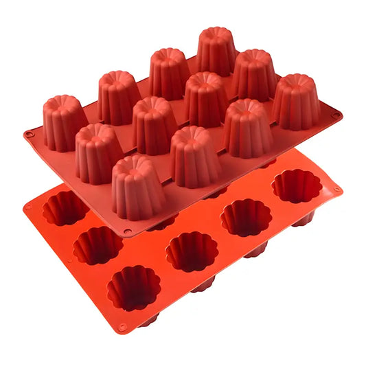 Deux moules en silicone rouge empilés, chacun doté de 12 cavités en forme de cannelés, conçus pour la pâtisserie.